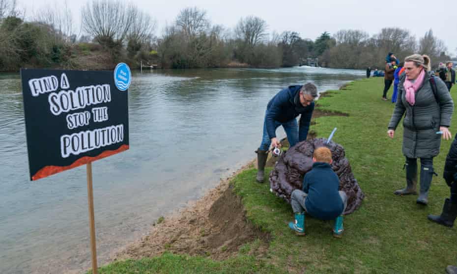 An anti-sewage protest  at Port Meadow, Oxford