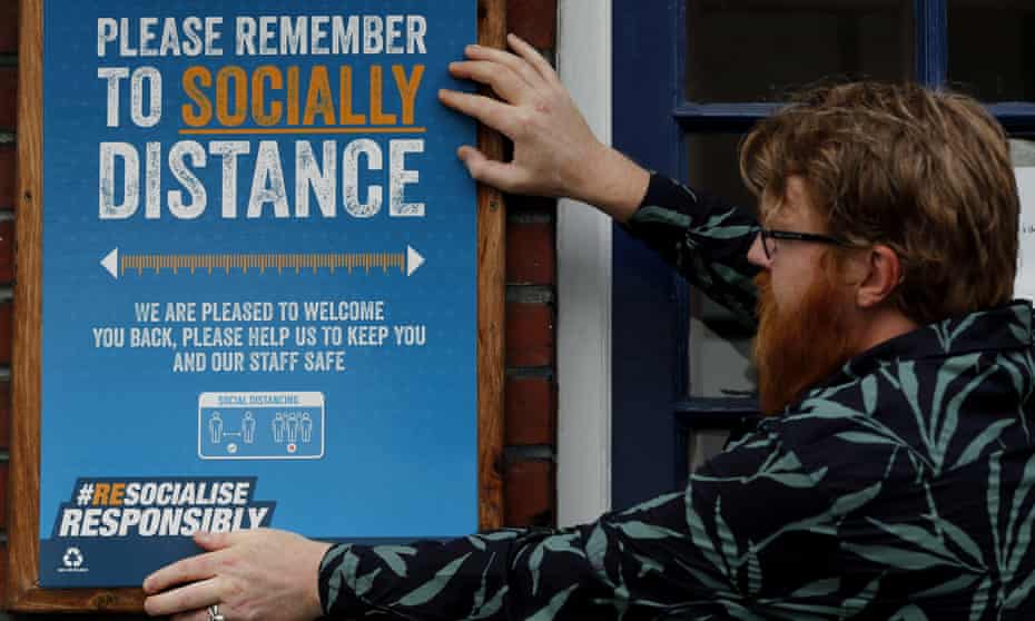 Social distancing signs go up at the Chandos Arms pub in London