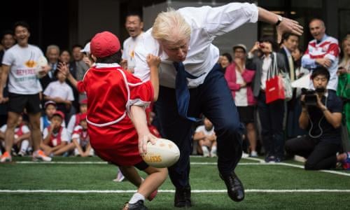 Boris Johnson Knocks Over 10 Year Old During Rugby Game In Japan Politics The Guardian