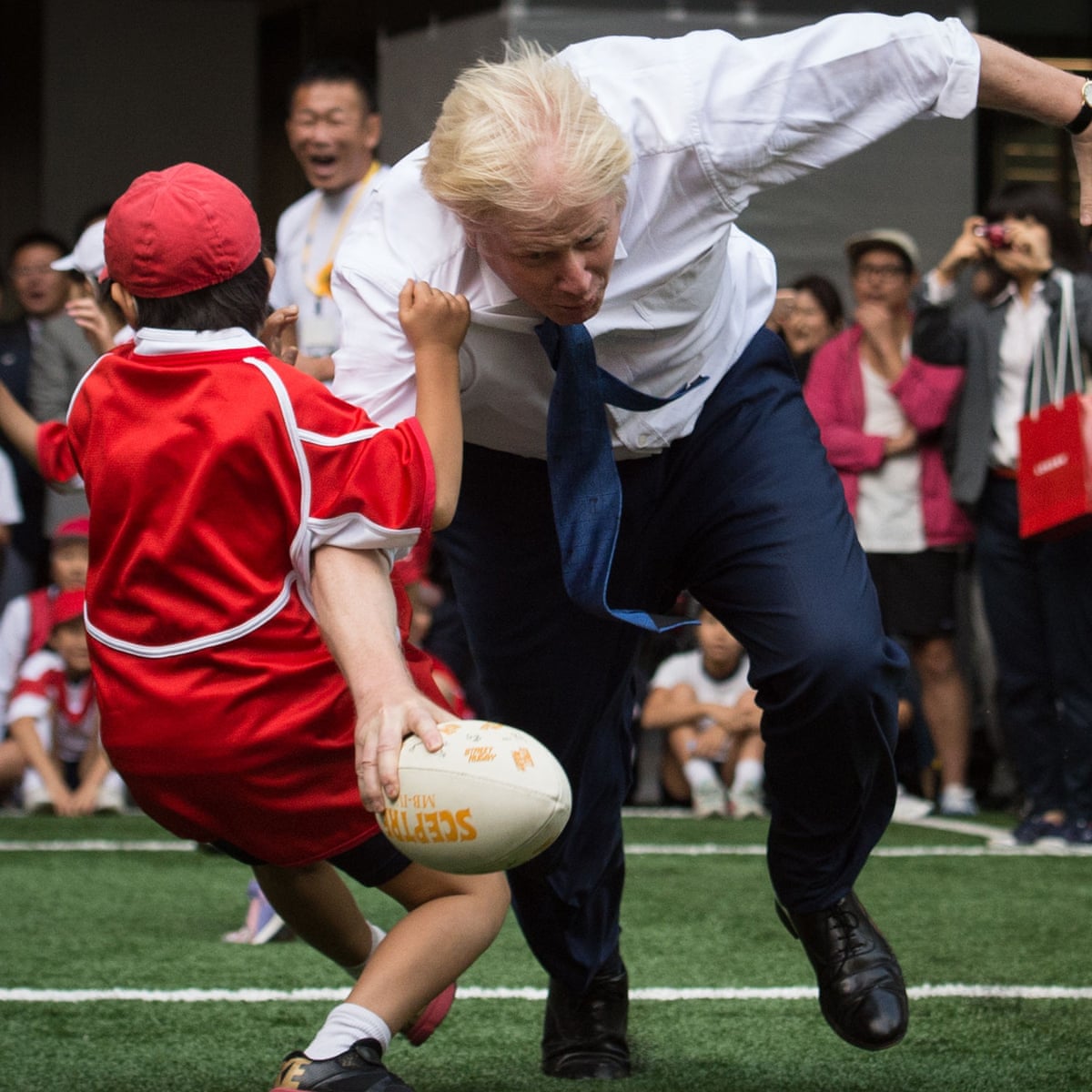 Boris Johnson Knocks Over 10 Year Old During Rugby Game In Japan Politics The Guardian
