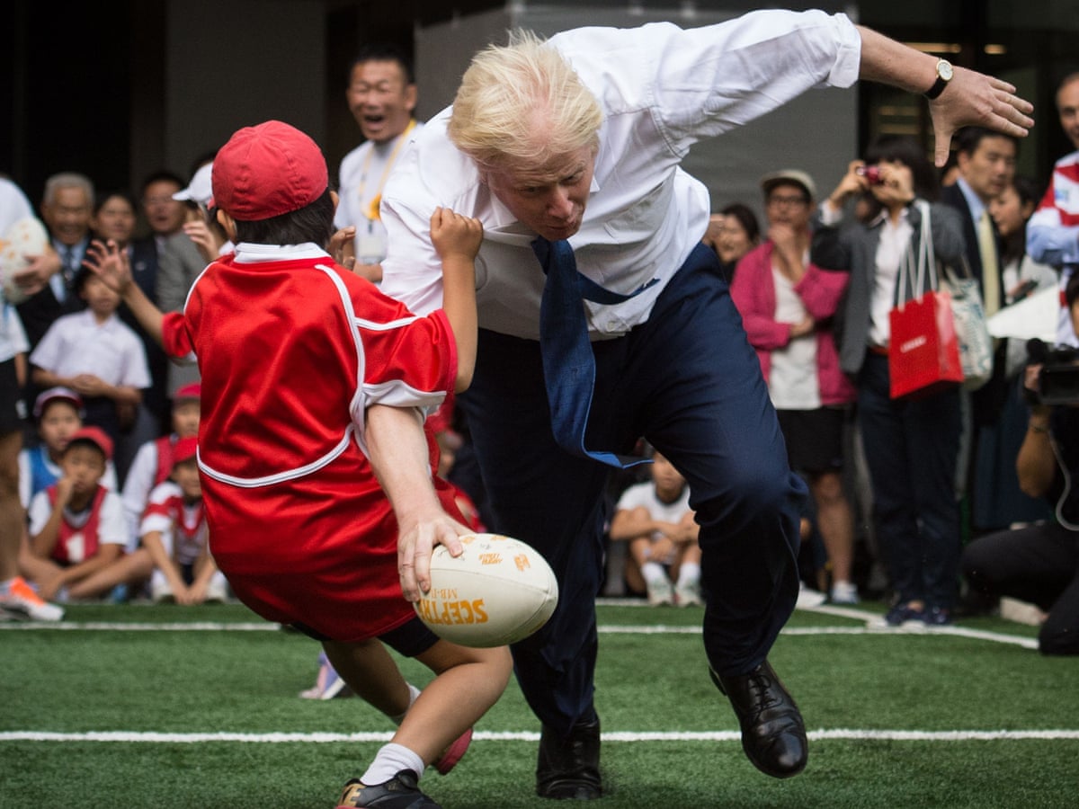 Boris Johnson Knocks Over 10 Year Old During Rugby Game In Japan Politics The Guardian