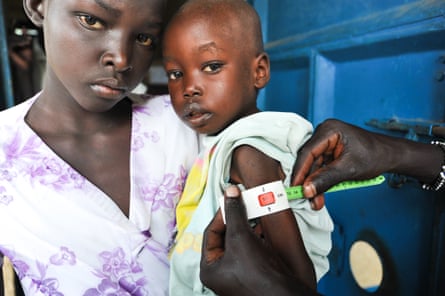 Yar, 11, with her cousin Apiu, two, at Abiriu primary health care centre in Western Lakes state, South Sudan.