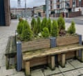 Medieval Peaseholme Green’s benches arranged around planters