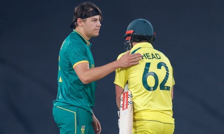 Travis Head is consoled by South Africa’s Gerald Coetzee