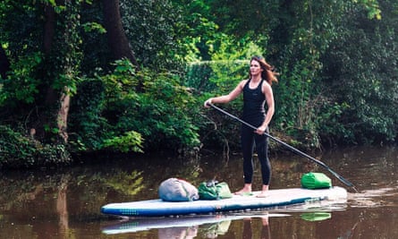 Water woman: Lizzie Carr travelled the waterways of England on a paddle board, logging plastic waste.