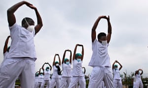 Nurses assigned to the Infectious Diseases Unit at the Kenyatta University Hospital in Nairobi dance during a Zumba class held at the hospital compound.