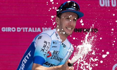 Simon Yates celebrates on the podium after winning the 14th stage of the Giro d'Italia from Santena to Turin.