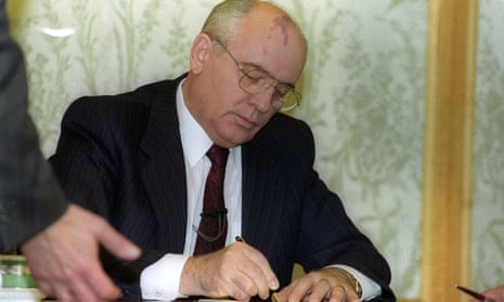 Soviet President Mikhail Gorbachev signs his resignation minutes before a live address on national television, 25 December  1991.