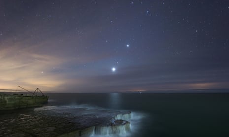 Venus, Mars and Jupiter align over the Isle of Portland, England. These three, plus Mercury and Uranus, will be visible in a ‘planetary parade’ on Tuesday.
