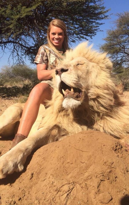 Kendall Jones poses with a lion she shot in Africa.