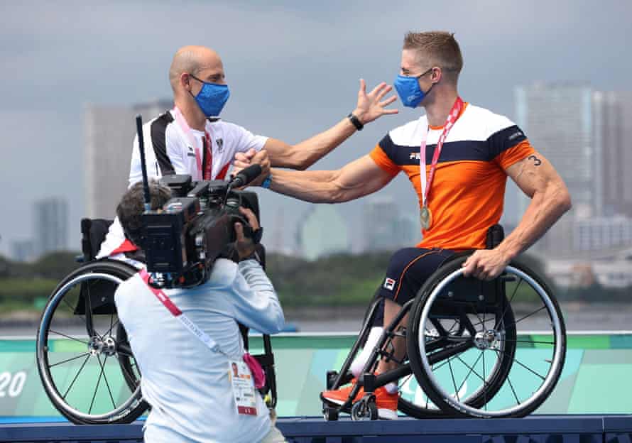 Silver Medallist Florian Brungraber of Austria and gold medallist Jetze Plat of the Netherlands celebrate on the podium.