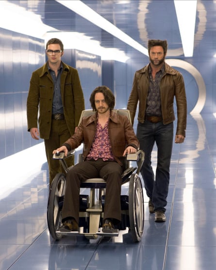 They proceed down a shiny corridor, McAvoy in a wheelchair