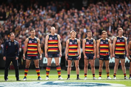The Crows line up for the national anthem in the 2017 grand final