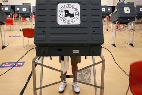 A voter casts their ballot at an early voting polling location for the presidential election in Houston, Texas, on 15 October 2020. 