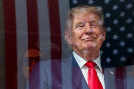An American flag and Donald Trump
