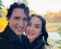Katy Perry and Justin Trudeau cheek to cheek and smiling