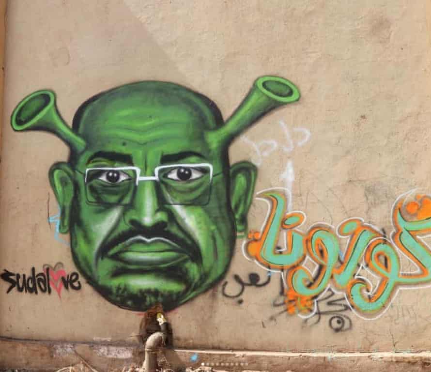 Street artist Assil Diab’s depiction of former dictator Omar al-Bashir as the face of coronavirus on a stadium wall in Bahri, Khartoum.