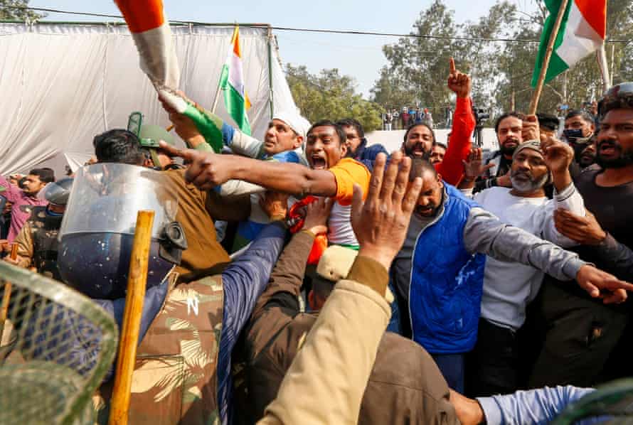 Police try to stop local residents during a clash with farmers at the Singhu camp on 29 January.