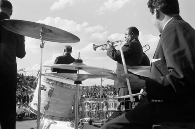 Armstrong and his band play at an outdoor venue (probably in Kenya), late 1960.