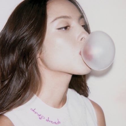 Olivia Rodrigo blowing bubblegum