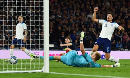 Harry Maguire reacts after scoring an own goal