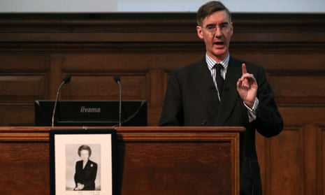 Jacob Rees-Mogg speaks during a meeting of the Bruges Group, behind a photograph of former prime minister Margaret Thatcher