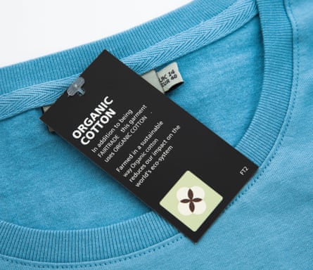 A swing tag on a T-shirt saying it was made in certified fair trade conditions, using organic cotton