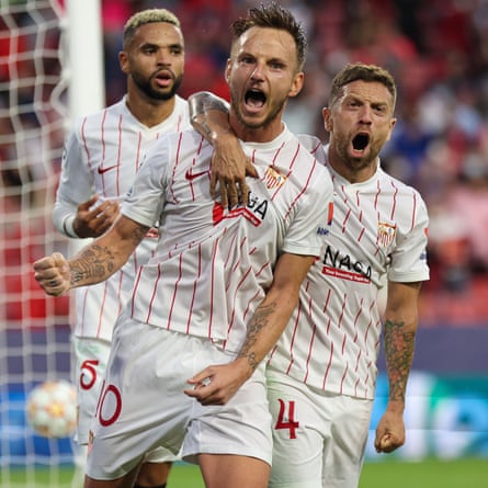 Ivan Rakitic (centre) celebrates after converting from the penalty spot for Sevilla.