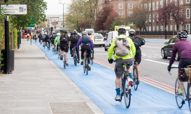 Cyclists using the segregated cycle superhighway at Kennington Oval in south London