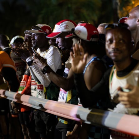 Athletes gather in the dark before the start of the Comrades Marathon in Durban