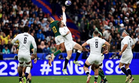 England’s Elliot Daly and Manie Libbok of South Africa compete for a high ball during the World Cup semi-final.