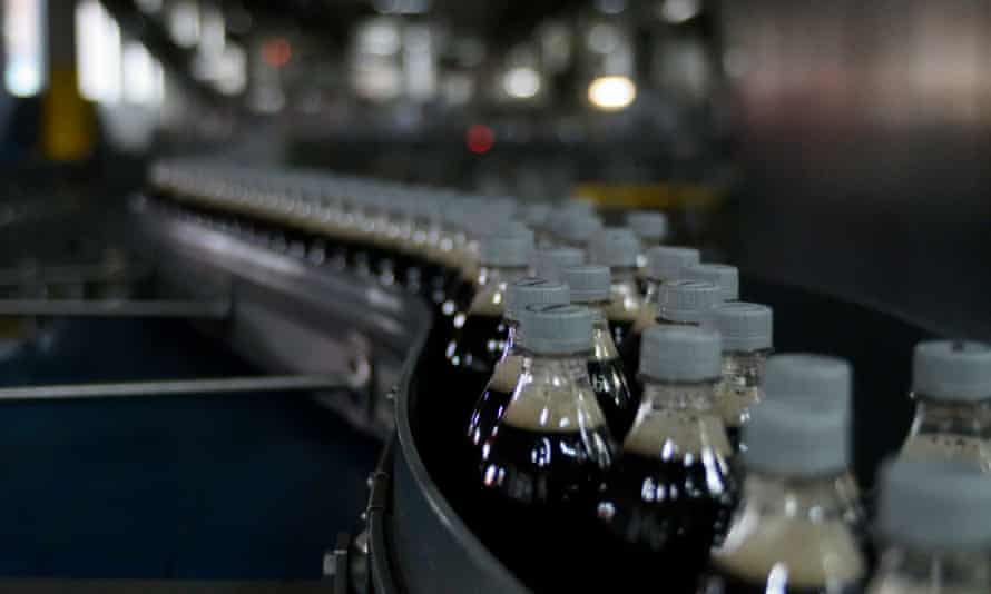 Bottles of Coca-Cola on a conveyor belt at a US factory.