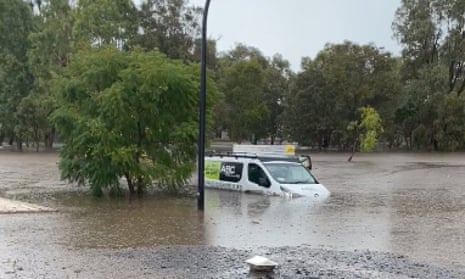 car submerged in floodwater
