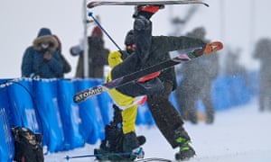 Finland’s Jon Sallinen collides with a camera operator during his first run in freestyle skiing halfpipe qualification.