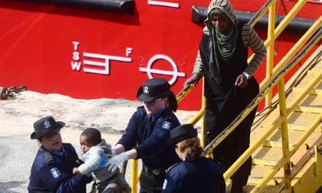 Migrants disembark from the merchant ship El Hiblu 1, after Maltese armed forces took control of the vessel. 