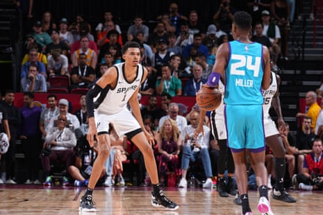 The Spurs’ Victor Wembanyama, left, and the Hornets’ Brandon Miller shared the floor in a showdown of the top two picks from June’s NBA draft.