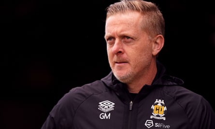 Garry Monk wearing a Cambridge United tracksuit