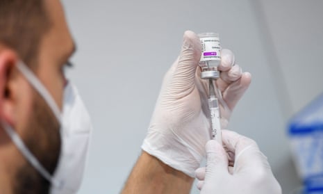 A medical worker at a Covid vaccination centre in Munich – Germany has given a first shot to 50% of its adult population.