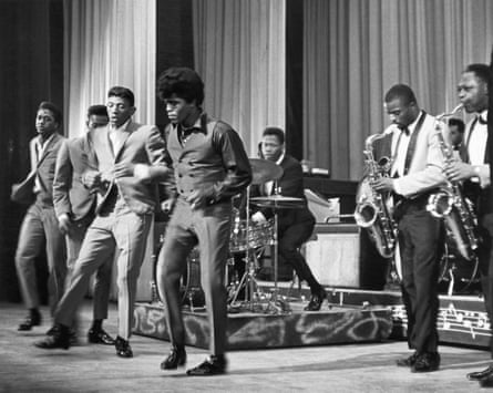 James Brown performs with the Famous Flames at the Apollo Theater in 1964.