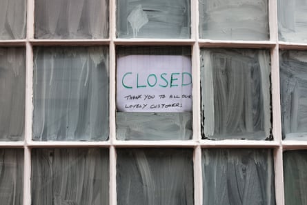 A sign reading 'Closed. Thank you to all our lovely customers' in the smeared window of a shop in Ashford town centre, Kent