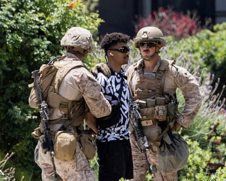 US marines detain a person outside the Wilshire Federal Building in Los Angeles.