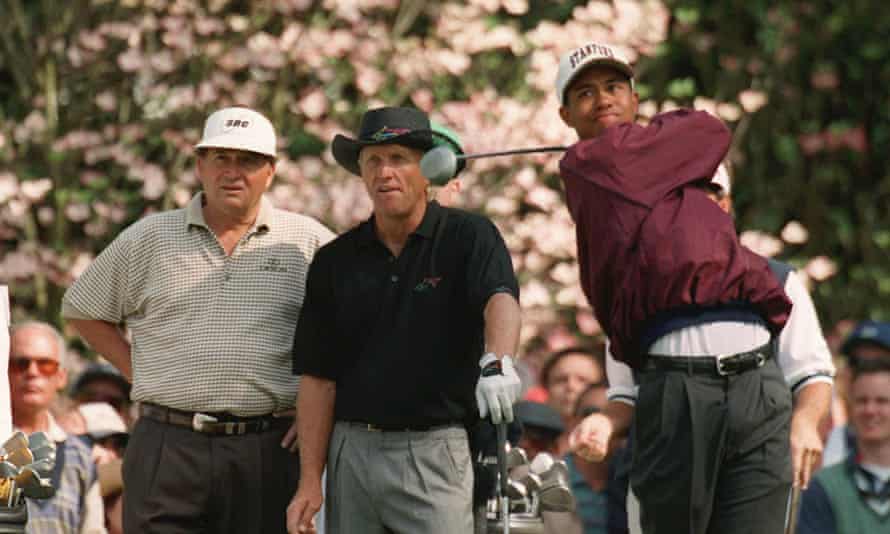 Greg Norman and Ray Floyd watch Tiger Woods practise at Augusta during the 1995 Masters.