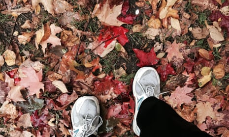 This Wednesday, Oct. 28, 2015 photo shows a jogger poised for a run in Prospect Park, in Brooklyn, N.Y., on a path covered with colorful autumn leaves. Novice runners who begins training in middle age must overcome fears of injury and the humiliation of being passed by younger, fitter millennials every time they go out on a run. (AP Photo/Beth J. Harpaz)