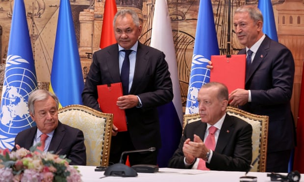 UN secretary-general Antonio Guterres, Russia's defence minister Sergei Shoigu and Turkish president Recep Tayyip Erdogan at the signing ceremony