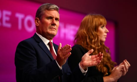 Labour party leader Keir Starmer and deputy leader Angela Rayner clap during the party’s annual conference, in Brighton on 25 September.