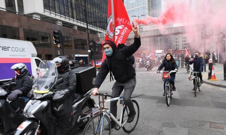 A rider from the Independent Workers' Union of Great Britain protesting in London in April.