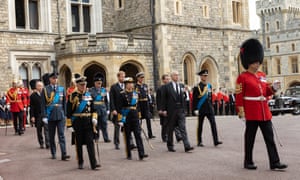 The King accompanied by the rest of the royal family walk behind the coffin as the funeral procession makes its way through the Windsor Castle grounds to St George’s Chapel before the committal service