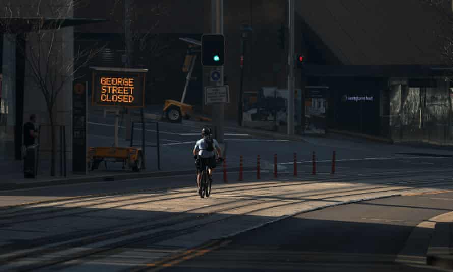 Anthony Albanese A police officer patrols the quiet George Street in Sydney as the city extended its two-month-old lockdown and introduced a partial curfew.
