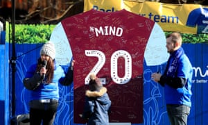 Aston Villa v Manchester City - Carabao Cup - Final - Wembley Stadium<br>A young supporter writes a message on a board in the shape of an Aston Villa top as part of the Mind mental health campaign prior to the beginning of the Carabao Cup Final at Wembley Stadium, London. PA Photo. Picture date: Sunday March 1, 2020. See PA story SOCCER Final. Photo credit should read: Mike Egerton/PA Wire. RESTRICTIONS: EDITORIAL USE ONLY No use with unauthorised audio, video, data, fixture lists, club/league logos or "live" services. Online in-match use limited to 120 images, no video emulation. No use in betting, games or single club/league/player publications.
