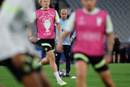 Pep Guardiola watches his players during Manchester City’s training sessuib at the Ataturk Olympic Stadium.
